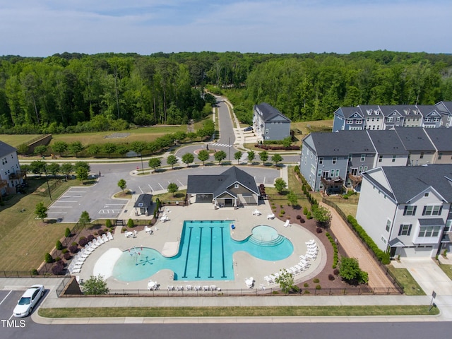 birds eye view of property with a forest view