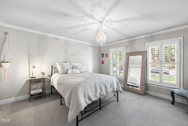 bedroom with visible vents, baseboards, a chandelier, ornamental molding, and carpet flooring