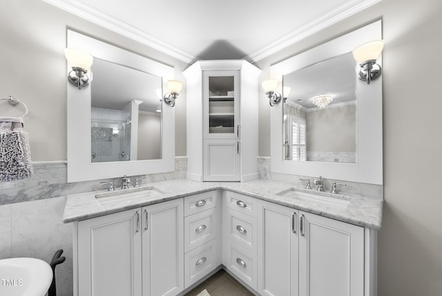full bath featuring a sink, tile walls, a wainscoted wall, and a tile shower