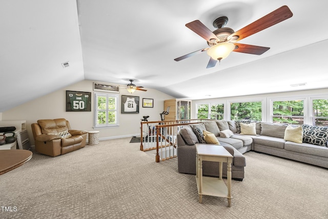 carpeted living area with ceiling fan, visible vents, and lofted ceiling