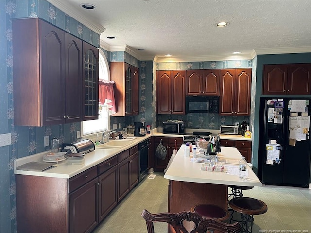 5400 Labrador Dr, Hope Mills, NC 28348 - kitchen with light floors, wallpapered walls, a sink, black appliances, and light countertops