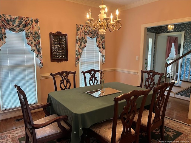 5400 Labrador Dr, Hope Mills, NC 28348 - dining space featuring an inviting chandelier, plenty of natural light, wood finished floors, and crown molding