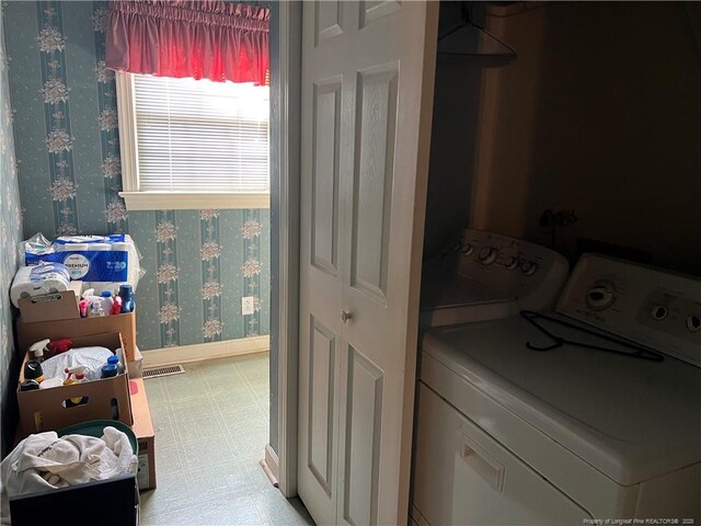 5400 Labrador Dr, Hope Mills, NC 28348 - laundry area with light floors, wallpapered walls, baseboards, visible vents, and laundry area