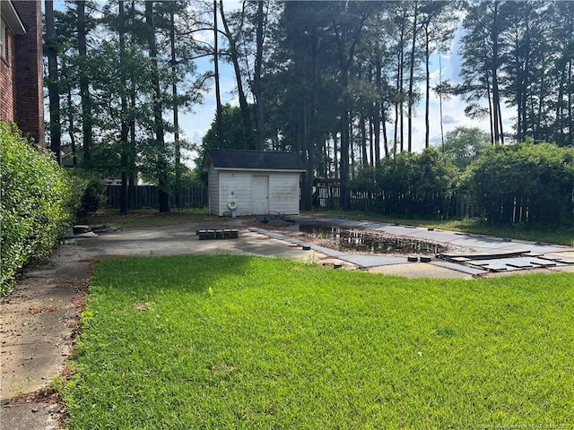 5400 Labrador Dr, Hope Mills, NC 28348 - view of yard with an outbuilding, a shed, and fence