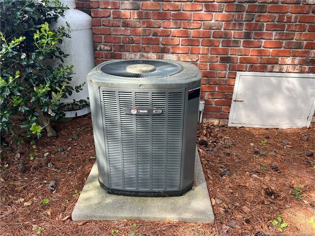 5400 Labrador Dr, Hope Mills, NC 28348 - exterior details with brick siding and central AC