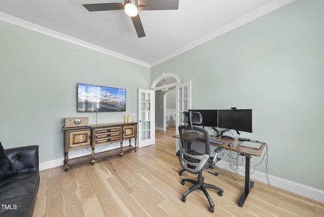 home office featuring crown molding, wood finished floors, baseboards, ceiling fan, and french doors