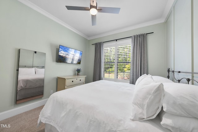 bedroom featuring crown molding, carpet floors, baseboards, and ceiling fan