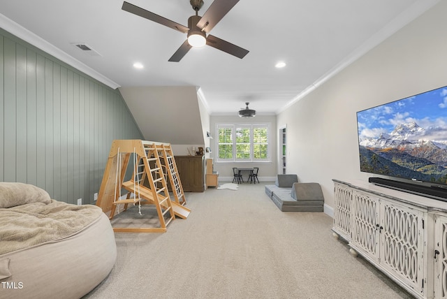 playroom featuring visible vents, a ceiling fan, crown molding, and carpet flooring