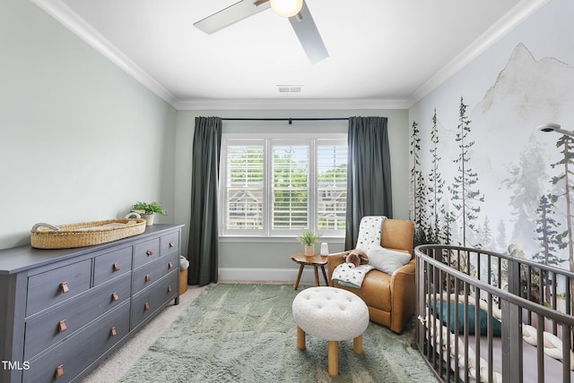 bedroom featuring carpet floors, a nursery area, visible vents, and ornamental molding