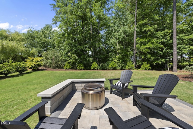 view of patio / terrace featuring a fire pit