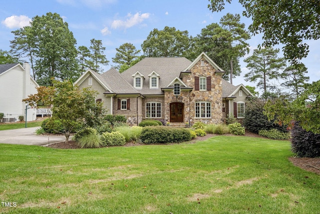 1605 Hunting Ridge Rd, Raleigh, NC 27615 - traditional home with stone siding and a front yard