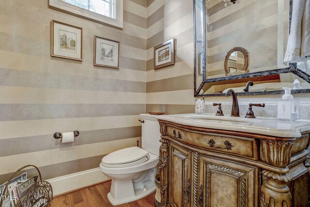 1605 Hunting Ridge Rd, Raleigh, NC 27615 - half bath with wood finished floors, toilet, and vanity