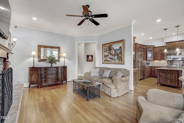 1605 Hunting Ridge Rd, Raleigh, NC 27615 - living area featuring light wood-type flooring, a ceiling fan, baseboards, and ornamental molding