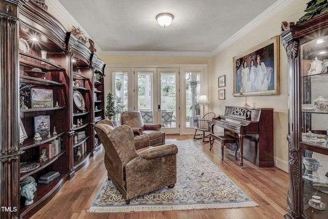 1605 Hunting Ridge Rd, Raleigh, NC 27615 - living area with wood finished floors, baseboards, ornamental molding, and french doors