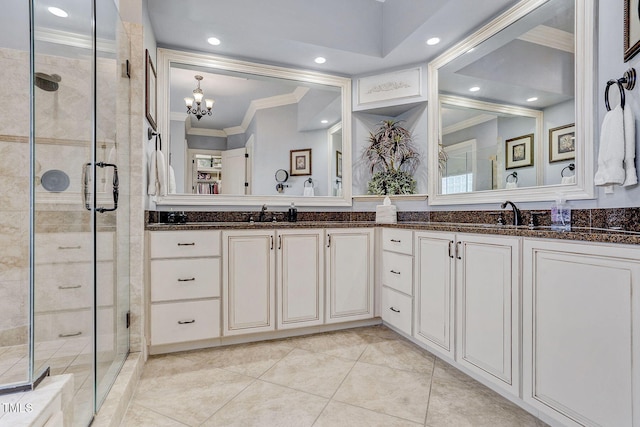 1605 Hunting Ridge Rd, Raleigh, NC 27615 - bathroom with a sink, double vanity, a stall shower, a chandelier, and crown molding