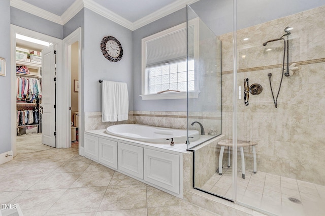 1605 Hunting Ridge Rd, Raleigh, NC 27615 - bathroom featuring a garden tub, a shower stall, ornamental molding, and a spacious closet