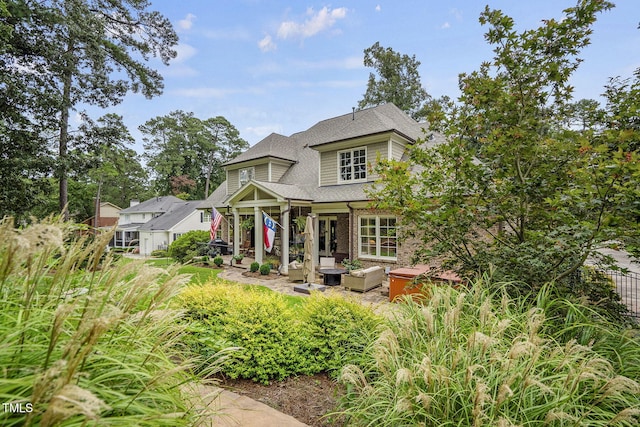 1605 Hunting Ridge Rd, Raleigh, NC 27615 - view of front facade with a patio area and a shingled roof