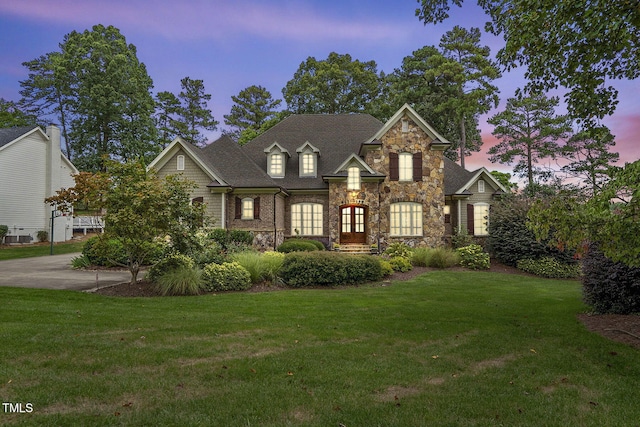 1605 Hunting Ridge Rd, Raleigh, NC 27615 - view of front of home with french doors, a front lawn, and stone siding