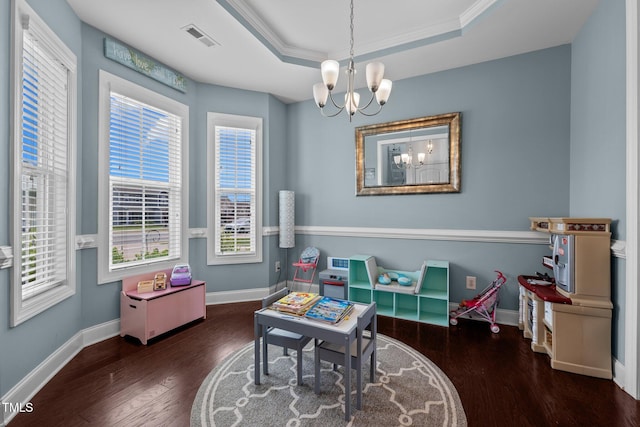 game room featuring visible vents, a raised ceiling, baseboards, wood finished floors, and a notable chandelier