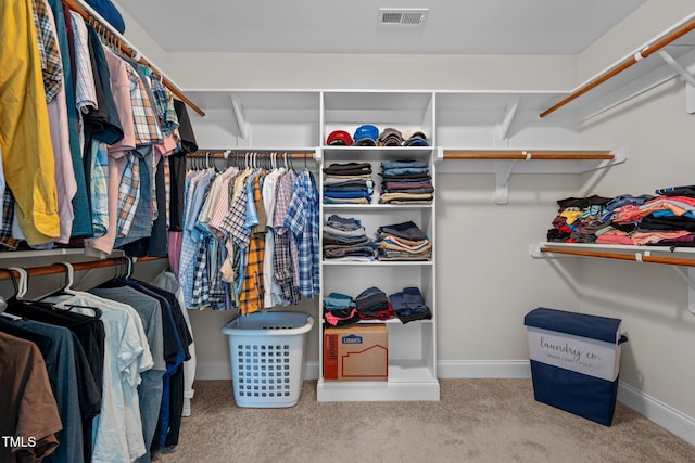 spacious closet featuring visible vents and carpet