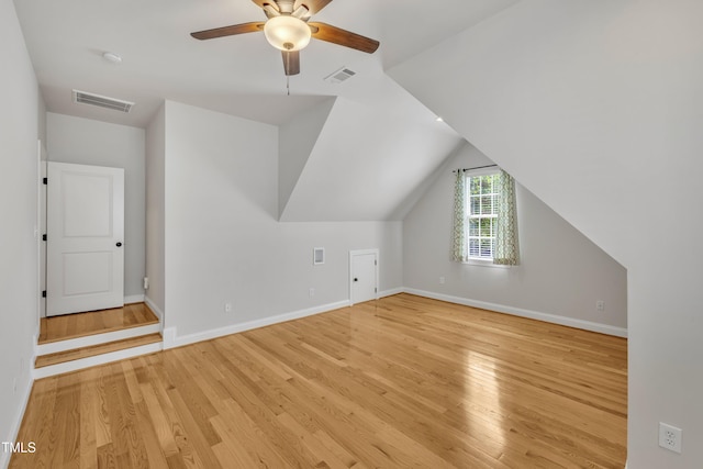 bonus room featuring baseboards, light wood finished floors, and visible vents