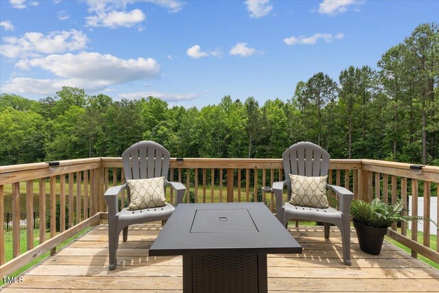 260 Amber Acorn Ave, Raleigh, NC 27603 - wooden deck featuring a forest view