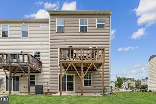 260 Amber Acorn Ave, Raleigh, NC 27603 - back of property with central air condition unit, a lawn, a patio area, and a deck
