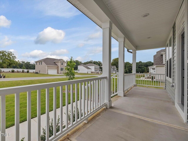 balcony featuring a porch and a residential view