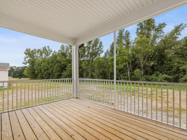 wooden deck featuring a yard
