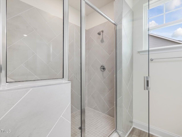 full bath with a shower stall