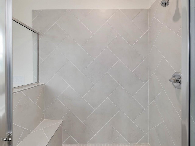 full bathroom featuring a tile shower