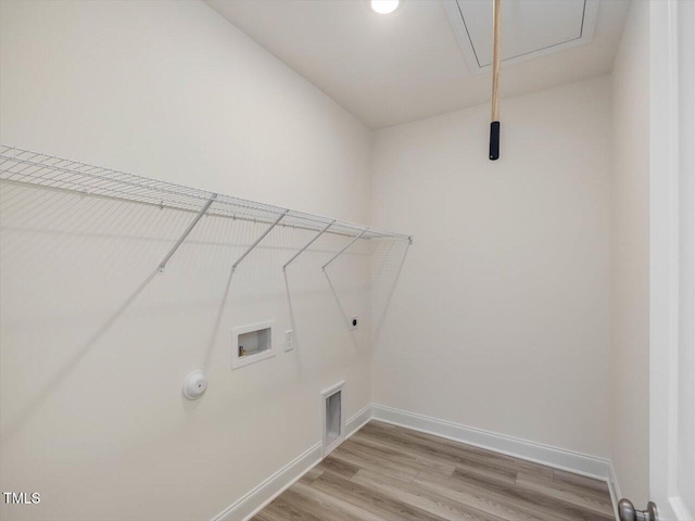 clothes washing area with hookup for a washing machine, laundry area, hookup for an electric dryer, hookup for a gas dryer, and attic access