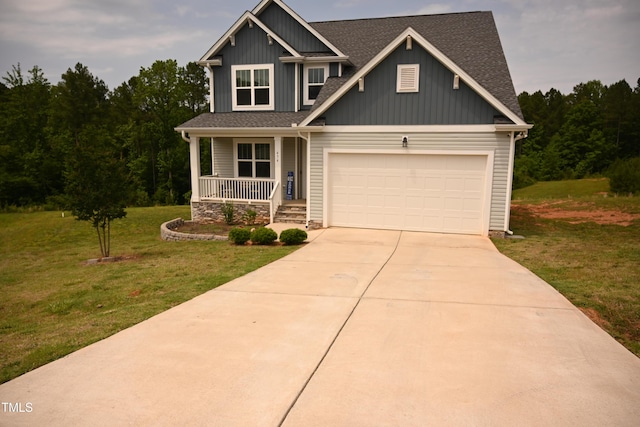 474 Ashpole Trl, Clayton, NC 27520 - craftsman inspired home with covered porch, driveway, a front lawn, an attached garage, and roof with shingles