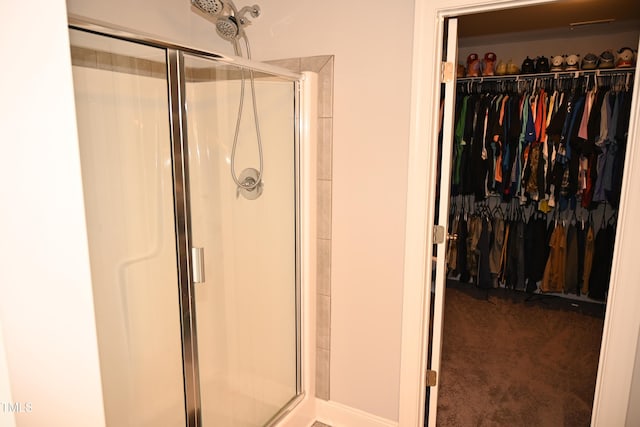 474 Ashpole Trl, Clayton, NC 27520 - bathroom with a stall shower and a walk in closet