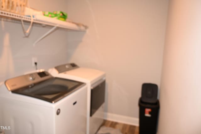 474 Ashpole Trl, Clayton, NC 27520 - washroom featuring washing machine and clothes dryer, wood finished floors, and baseboards