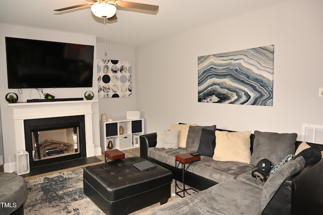 474 Ashpole Trl, Clayton, NC 27520 - living area with a ceiling fan, wood finished floors, and a fireplace with flush hearth