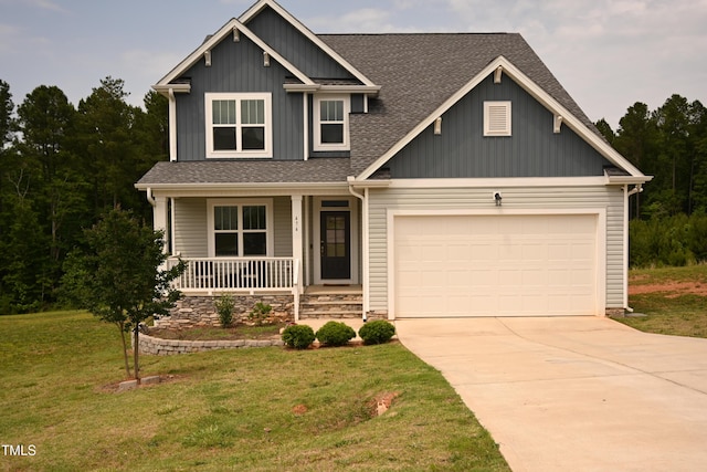 474 Ashpole Trl, Clayton, NC 27520 - craftsman house featuring a porch, roof with shingles, an attached garage, driveway, and a front yard