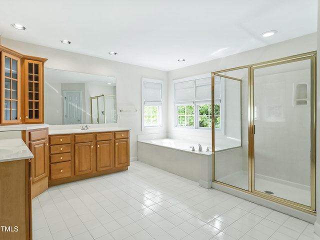 bathroom with vanity, tile patterned floors, recessed lighting, a garden tub, and a stall shower