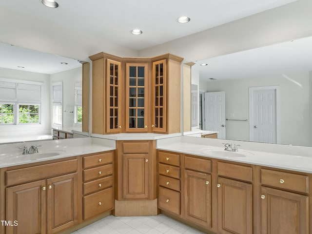 bathroom with tile patterned floors, vanity, and recessed lighting