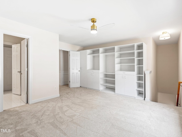 unfurnished bedroom with baseboards and light colored carpet