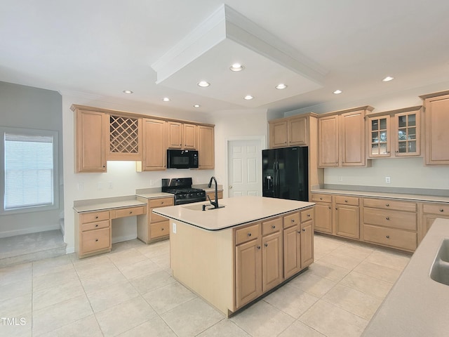 kitchen featuring a sink, light tile patterned floors, light brown cabinetry, and black appliances