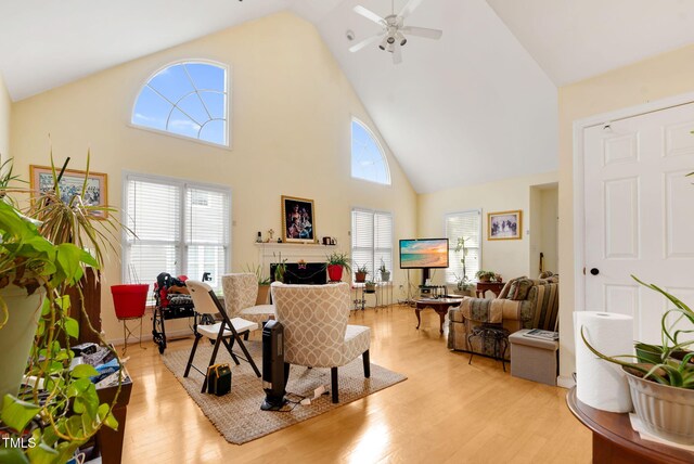 17 Nicklaus Way, Clayton, NC 27520 - living room with light wood-type flooring, a ceiling fan, a fireplace, and high vaulted ceiling
