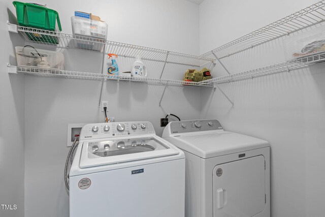 laundry room with laundry area and washer and clothes dryer