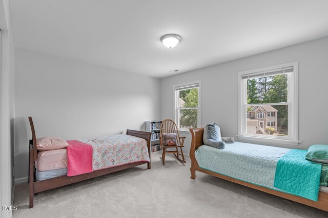 bedroom featuring visible vents and carpet