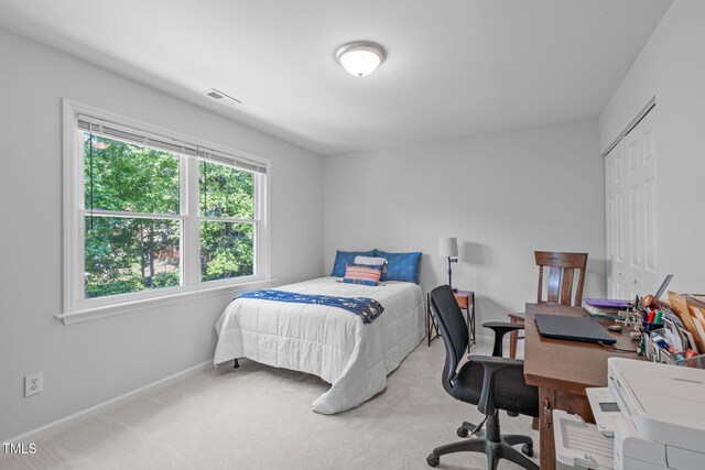 bedroom featuring carpet floors, baseboards, and visible vents