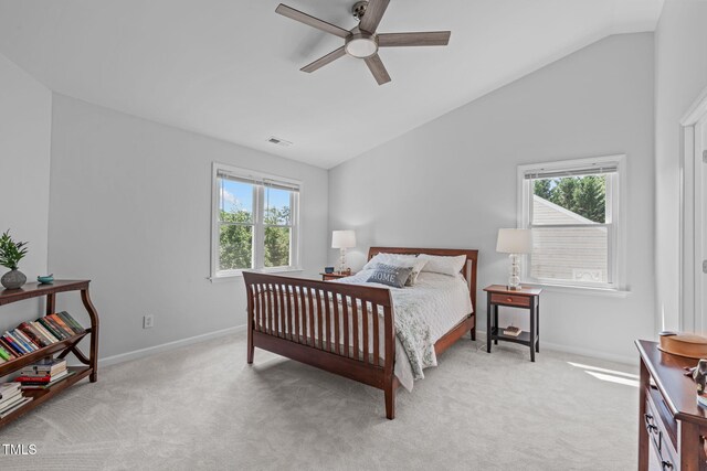 bedroom featuring multiple windows, light carpet, and vaulted ceiling