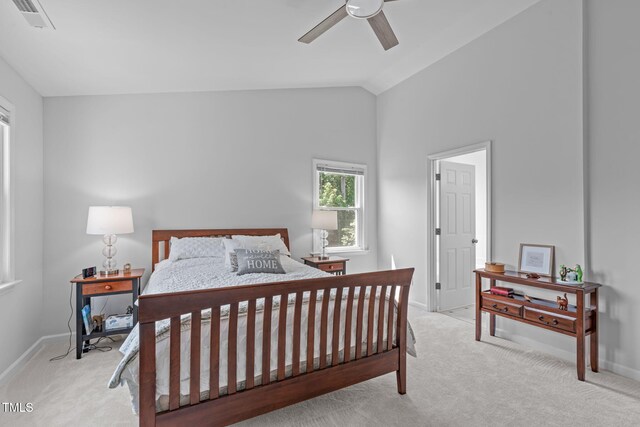 bedroom with carpet floors, baseboards, visible vents, and lofted ceiling