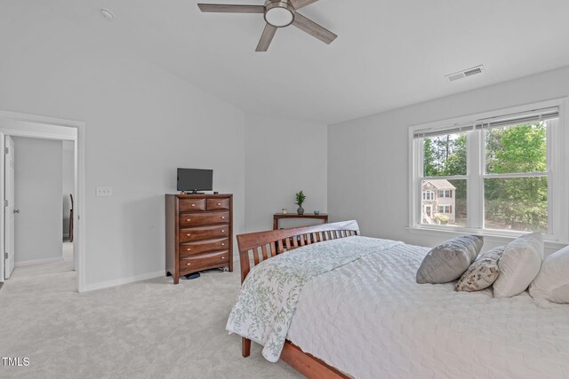 bedroom with carpet floors, ceiling fan, visible vents, and baseboards