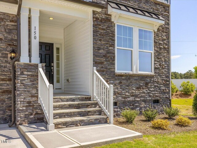 33 Celtic Ln, Lillington, NC 27546 - property entrance with crawl space and stone siding