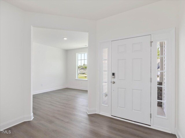 33 Celtic Ln, Lillington, NC 27546 - entryway featuring baseboards and dark wood-type flooring